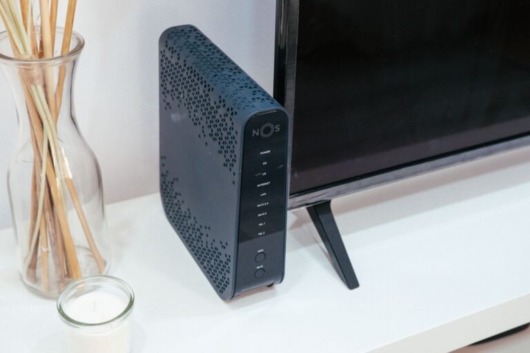 A sleek home technology setup featuring a router and television.