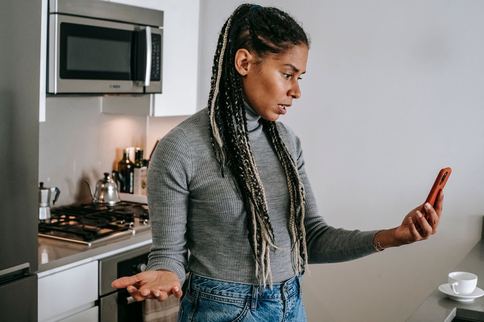Person looking frustrated while using a smartphone