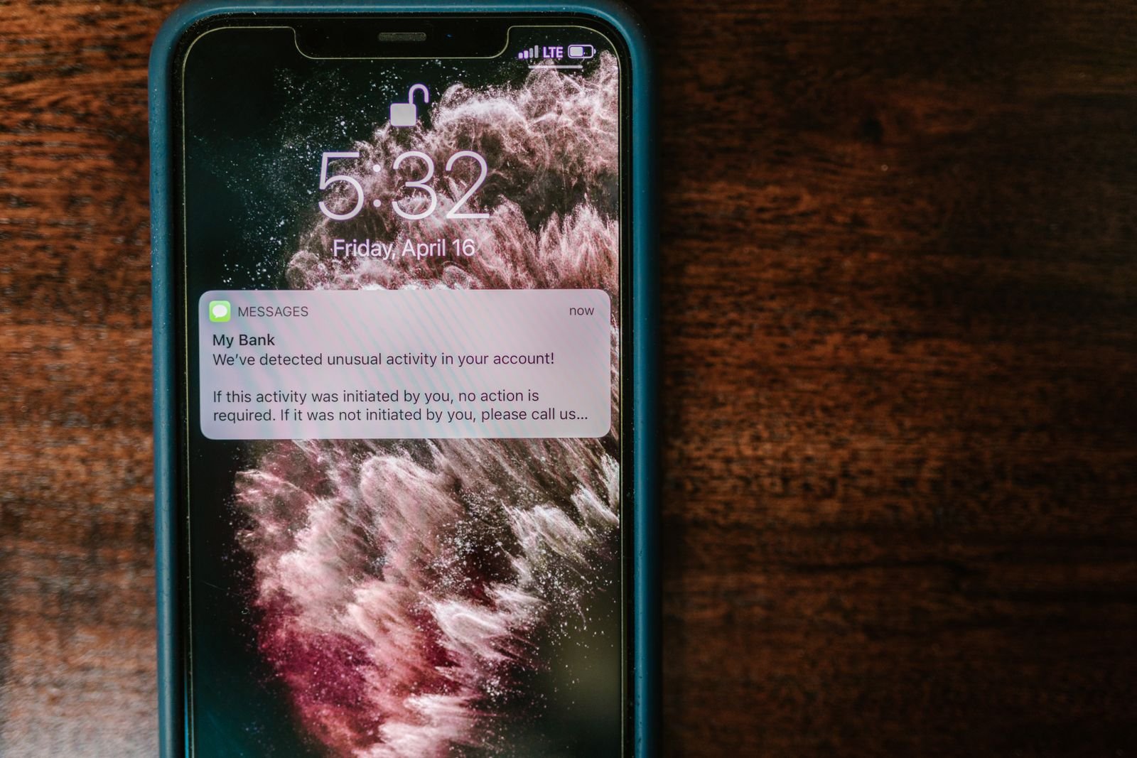 Close-up of a smartphone displaying a bank alert notification